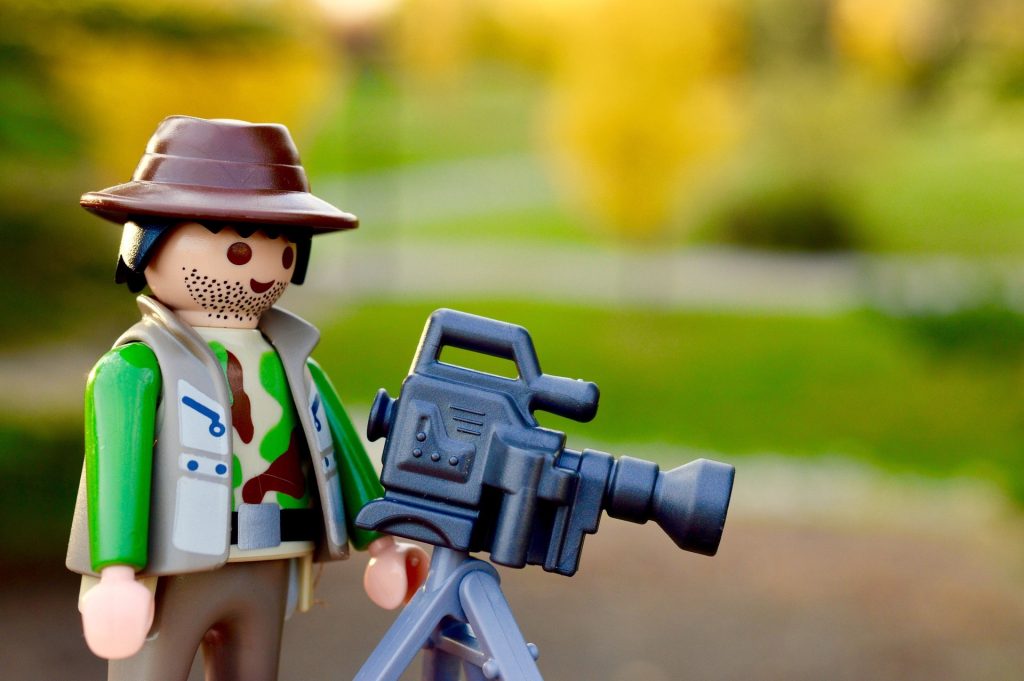 Lego character will film camera pretending to film movies
